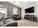 Comfortable living room featuring plush seating, a fireplace, and a large flat-screen TV at 17290 N 170Th Ln, Surprise, AZ 85374