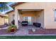 Inviting covered patio with stylish outdoor seating, perfect for relaxing or entertaining guests at 17290 N 170Th Ln, Surprise, AZ 85374
