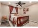 Inviting bedroom with a wood bed frame, plush rug, and artistic decor for a serene retreat at 1753 E Maddison Cir, San Tan Valley, AZ 85140