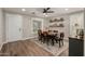Charming dining room with wood floors, a stylish rug, and decorative shelving at 1753 E Maddison Cir, San Tan Valley, AZ 85140
