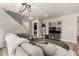 Comfortable living room with a sectional sofa, blanket ladder, and stairs to the upper level at 1753 E Maddison Cir, San Tan Valley, AZ 85140