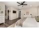 Spacious main bedroom boasts wood floors, walk-in closet and decorative accents for a stylish retreat at 1753 E Maddison Cir, San Tan Valley, AZ 85140