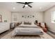 Comfortable main bedroom featuring a ceiling fan, large bed, dresser, and ample natural light at 1753 E Maddison Cir, San Tan Valley, AZ 85140