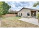 Spacious backyard with green grass, block fence, and mature trees at 20419 N 34Th St, Phoenix, AZ 85050