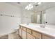 A well-lit bathroom features a double sink vanity and a glass-enclosed shower at 20419 N 34Th St, Phoenix, AZ 85050