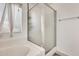 Bright bathroom featuring a tub and separate shower with translucent glass door at 20419 N 34Th St, Phoenix, AZ 85050