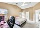 A well-lit bedroom boasts a bed, workspace, and ensuite bathroom, combining rest and productivity at 20419 N 34Th St, Phoenix, AZ 85050
