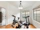 Home gym features laminate floors, neutral walls, and exercise equipment at 20419 N 34Th St, Phoenix, AZ 85050