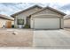 Charming single-story home featuring a two-car garage and low-maintenance desert landscaping at 20419 N 34Th St, Phoenix, AZ 85050