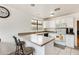 Bright kitchen with white cabinets, countertops, and appliances at 20419 N 34Th St, Phoenix, AZ 85050