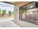 Covered patio featuring a large window and a decorative rock feature at 20419 N 34Th St, Phoenix, AZ 85050