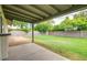 Spacious backyard with a covered patio and block wall at 2110 E Kathleen Rd, Phoenix, AZ 85022