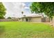 Large, green backyard with mature trees, providing a serene outdoor space at 2110 E Kathleen Rd, Phoenix, AZ 85022