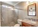 Bathroom featuring a shower with glass door, sink, and toilet at 2110 E Kathleen Rd, Phoenix, AZ 85022