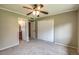 Bedroom featuring a ceiling fan, closet, and an attached bathroom at 2110 E Kathleen Rd, Phoenix, AZ 85022