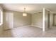 Open dining room with bright tile floors and a stylish pendant light fixture at 2110 E Kathleen Rd, Phoenix, AZ 85022