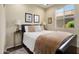 Cozy bedroom boasts a comfortable bed, side tables, and a bright window, creating a relaxing space at 21573 N 261St Ave, Buckeye, AZ 85396