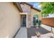 Inviting front entry with manicured landscaping and a decorative front door at 21573 N 261St Ave, Buckeye, AZ 85396