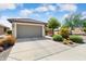 Gorgeous home with two car garage, neutral color scheme, desert landscaping and beautiful curb appeal at 21573 N 261St Ave, Buckeye, AZ 85396