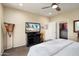 Bedroom showcasing an entertainment center and closet access, offering a blend of comfort and practicality at 21573 N 261St Ave, Buckeye, AZ 85396