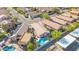Aerial view of a suburban home with a private pool and solar panels on the roof at 21605 N 48Th Pl, Phoenix, AZ 85054