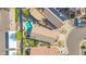 Overhead shot of a home with a turquoise pool, artificial turf, and solar panels on neighboring homes at 21605 N 48Th Pl, Phoenix, AZ 85054
