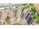 Aerial view of a neighborhood featuring lush landscaping and several backyard swimming pools at 21605 N 48Th Pl, Phoenix, AZ 85054