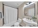 Cozy bathroom features a shower with curtain, tiled floors and walls and a basin at 21605 N 48Th Pl, Phoenix, AZ 85054