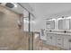 Bathroom with a tiled shower, tub, and double vanity at 21605 N 48Th Pl, Phoenix, AZ 85054