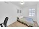 Bright bedroom features a comfy bed, neutral walls, and sleek floors at 21605 N 48Th Pl, Phoenix, AZ 85054