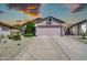 Charming home featuring a well-maintained exterior, a two-car garage, and low maintenance landscaping at 21605 N 48Th Pl, Phoenix, AZ 85054