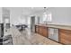 An open concept kitchen featuring stone countertops and stainless steel appliances and eating nook at 21605 N 48Th Pl, Phoenix, AZ 85054