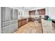 Bright kitchen featuring stainless steel appliances, stone countertops, and wood cabinets at 21605 N 48Th Pl, Phoenix, AZ 85054
