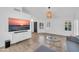 Bright living room with modern furnishings, sleek white walls, and plantation shutters at 21605 N 48Th Pl, Phoenix, AZ 85054