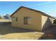Backyard view showcasing the home's exterior, lawn, and potential for outdoor enjoyment at 2324 W Darrel Rd, Phoenix, AZ 85041