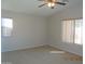 Spacious carpeted bedroom with large windows allowing natural light at 2324 W Darrel Rd, Phoenix, AZ 85041