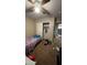 Bedroom featuring neutral walls, a ceiling fan, closet, and carpet flooring at 2324 W Darrel Rd, Phoenix, AZ 85041