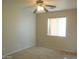 Comfortable bedroom with neutral walls, carpet flooring, and bright window at 2324 W Darrel Rd, Phoenix, AZ 85041