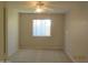 Spacious bedroom offering neutral walls and a bright window at 2324 W Darrel Rd, Phoenix, AZ 85041
