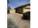 Single-story home with desert landscaping and gated backyard access at 2324 W Darrel Rd, Phoenix, AZ 85041