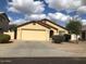 Charming single-story home with a well-maintained front yard and attached two-car garage at 2324 W Darrel Rd, Phoenix, AZ 85041