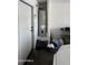 Garage interior view, showcasing the water heater, storage capacity, and an exit door at 2324 W Darrel Rd, Phoenix, AZ 85041