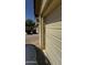 Attached garage, exterior security keypad, and desert landscaping at 2324 W Darrel Rd, Phoenix, AZ 85041