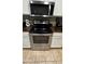 Stainless steel oven range and microwave enhance the kitchen's appeal at 2324 W Darrel Rd, Phoenix, AZ 85041