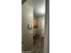 Functional laundry room featuring tile flooring, built-in cabinets, and essential utility connections at 2324 W Darrel Rd, Phoenix, AZ 85041