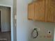 Laundry room with overhead cabinets and a washing machine hook-up at 2324 W Darrel Rd, Phoenix, AZ 85041