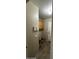Functional laundry room featuring tile flooring, built-in cabinets, and essential utility connections at 2324 W Darrel Rd, Phoenix, AZ 85041