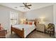 Comfortable bedroom with wood furniture, plantation shutters, and a relaxing atmosphere at 24816 S Golfview Dr # 46, Sun Lakes, AZ 85248