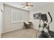 Spare bedroom with a ceiling fan, work area, and exercise equipment for a home gym setup at 24816 S Golfview Dr # 46, Sun Lakes, AZ 85248