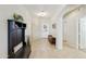 Inviting foyer with tile flooring, decorative bench, coat rack, and views into the bright interior at 24816 S Golfview Dr # 46, Sun Lakes, AZ 85248